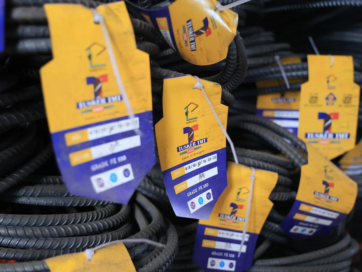 Tusker TMT 550D brand sticker and certification tags on coil bundles